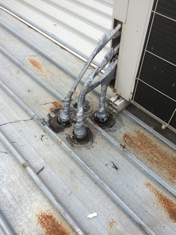 Roof Leaks on Commercial Buildings | Taped AC Pipes to Prevent Water Ingress | Melbourne | Roofrite Commercial